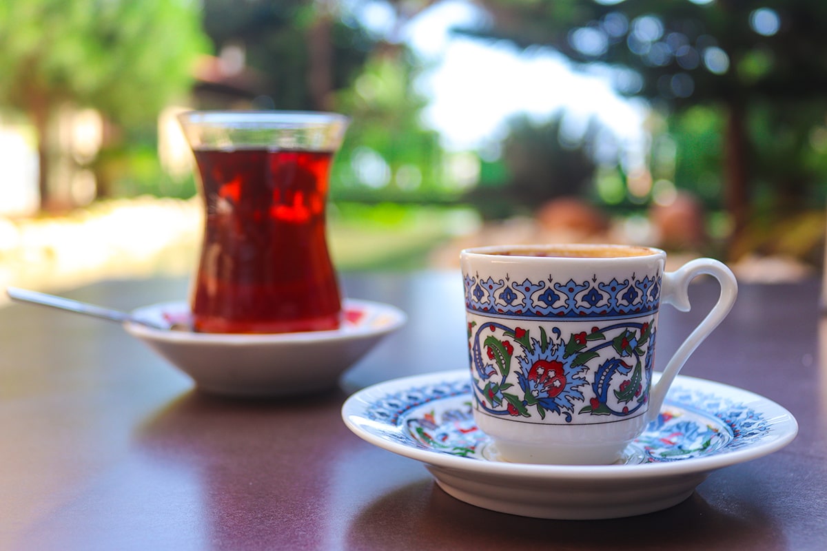 تضخم الأنا -A cup of tea on a table representing بشائر الخير.