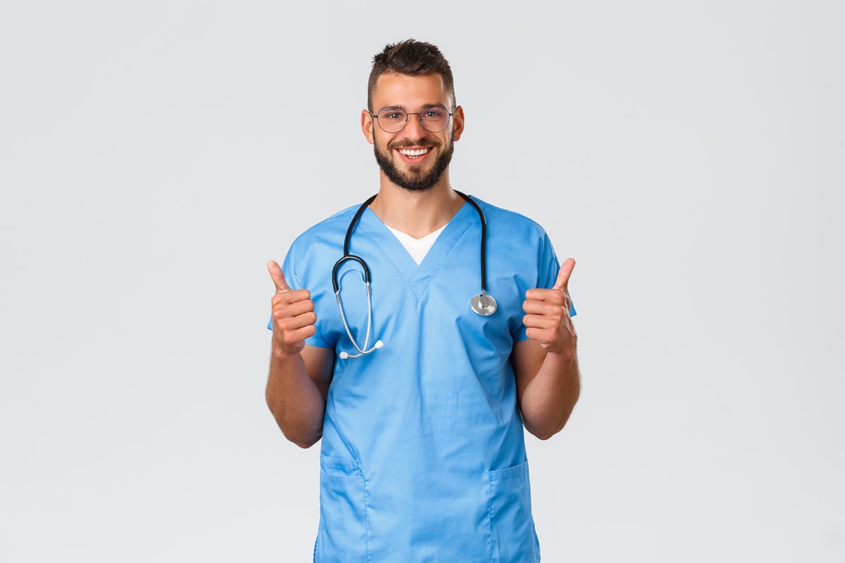 صعوبة التعامل والاندماج-A doctor giving a thumbs-up on a white background, expressing approval.