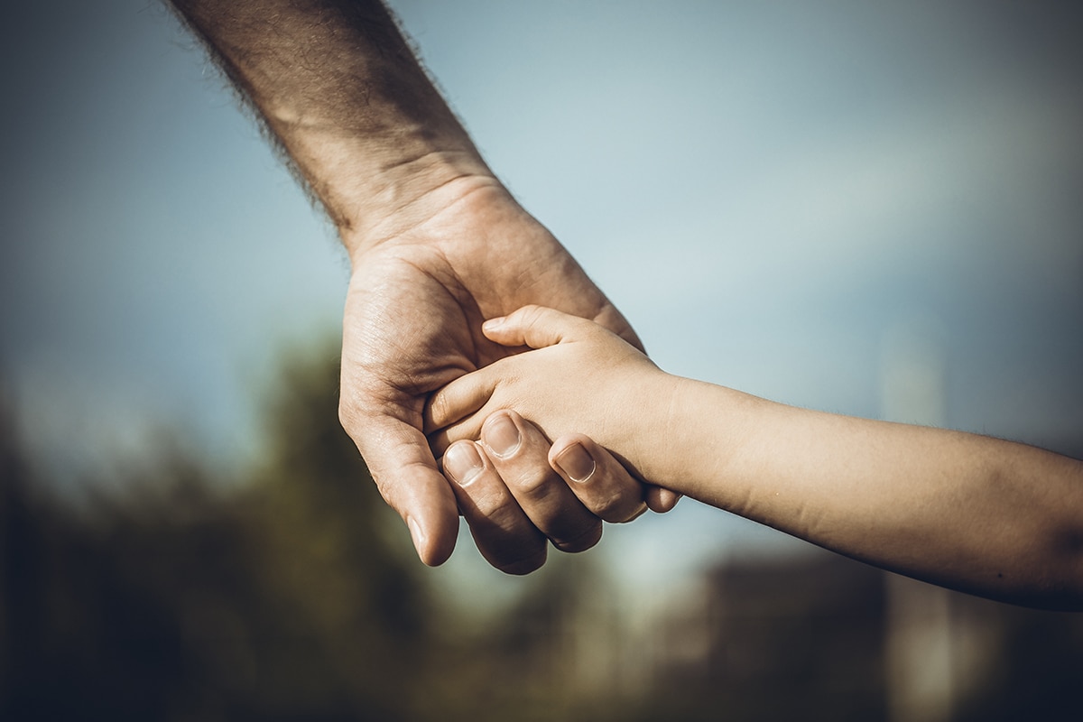 الاستجابة لنداء الضمير-A man holding a child's hand, emphasizing the consequences of persistent wrongdoing.